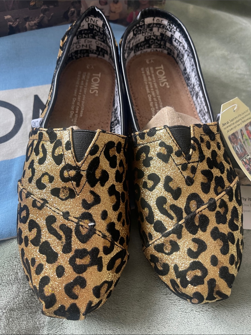 Toms Leopard Print Slip-Ons in Black and Brown